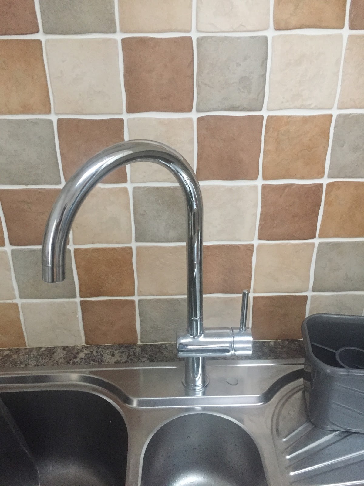 Chrome kitchen mixer tap fitted